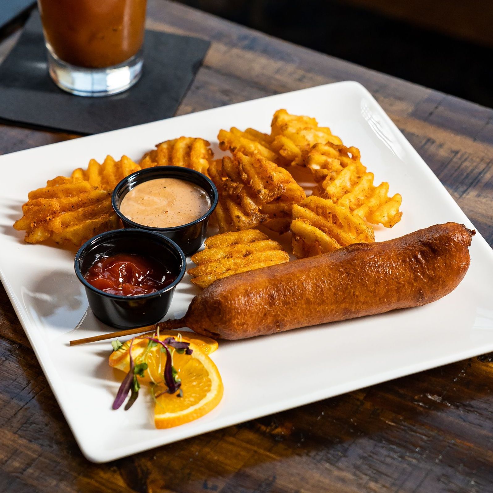 Waffle fries and corn dog delivered from Tony Tenderonis in Denver