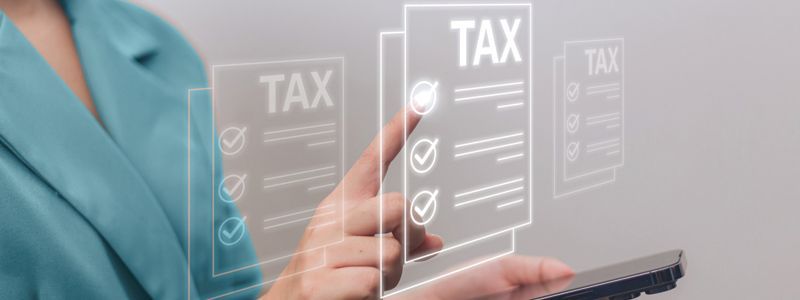 A woman is using a smartphone to check her taxes.