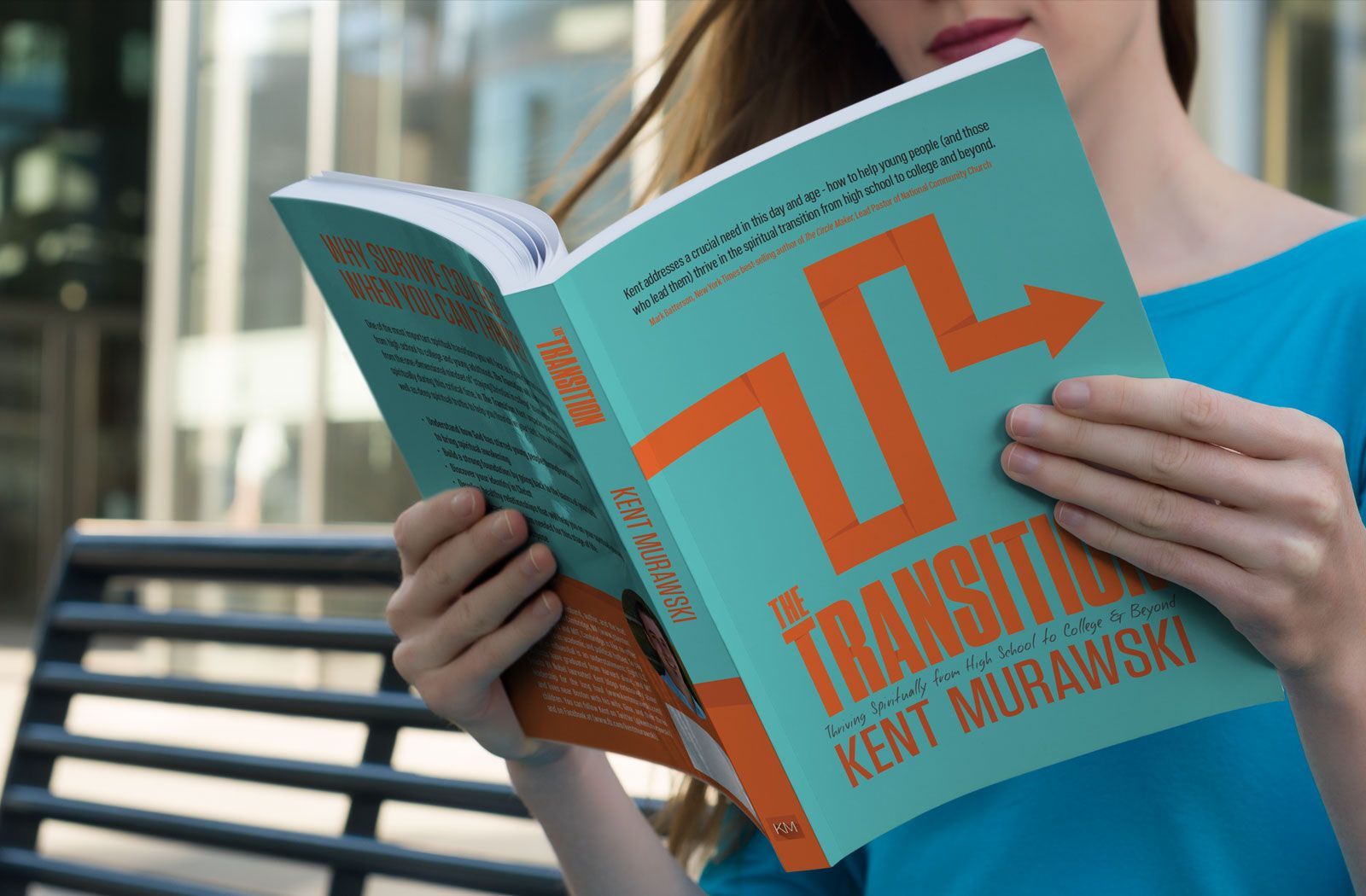 Woman reading a book titled 