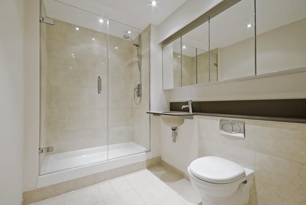 A Bathroom With A Toilet , Sink , Shower And Mirror — MRS–Mirrors, Robes & Shower Screens In Yarrawonga, NT
