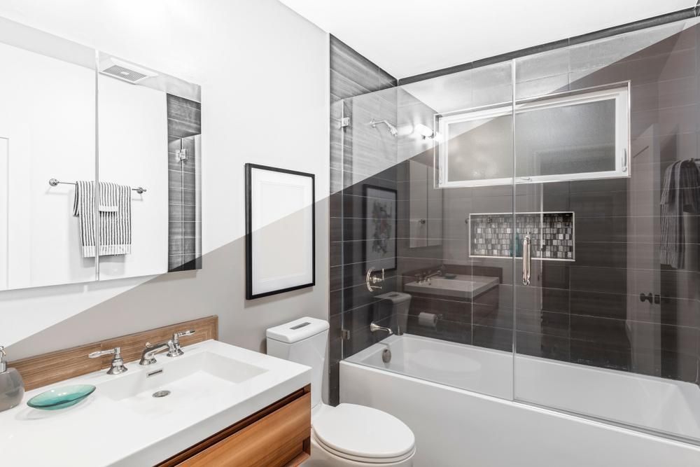 A Bathroom With A Toilet , Sink , And Bathtub — MRS–Mirrors, Robes & Shower Screens In Palmerston, NT