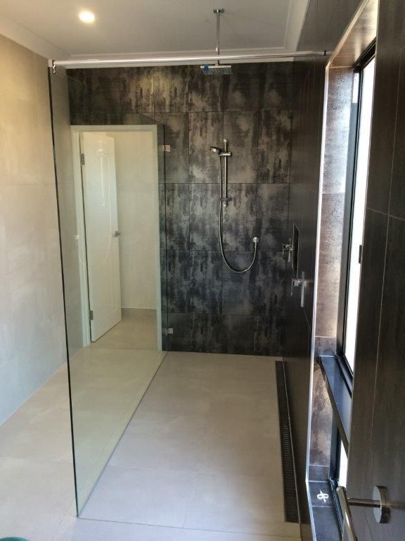 A Bathroom With A Walk In Shower And A Window — MRS–Mirrors, Robes & Shower Screens In Yarrawonga, NT

