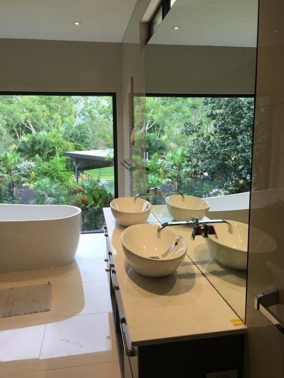 A Bathroom With Two Sinks , A Tub And A Large Mirror — MRS–Mirrors, Robes & Shower Screens In Darwin, NT