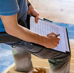 Home Inspector examing a home.