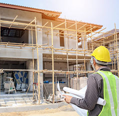 Home Inspector Monitoring New Construction Site