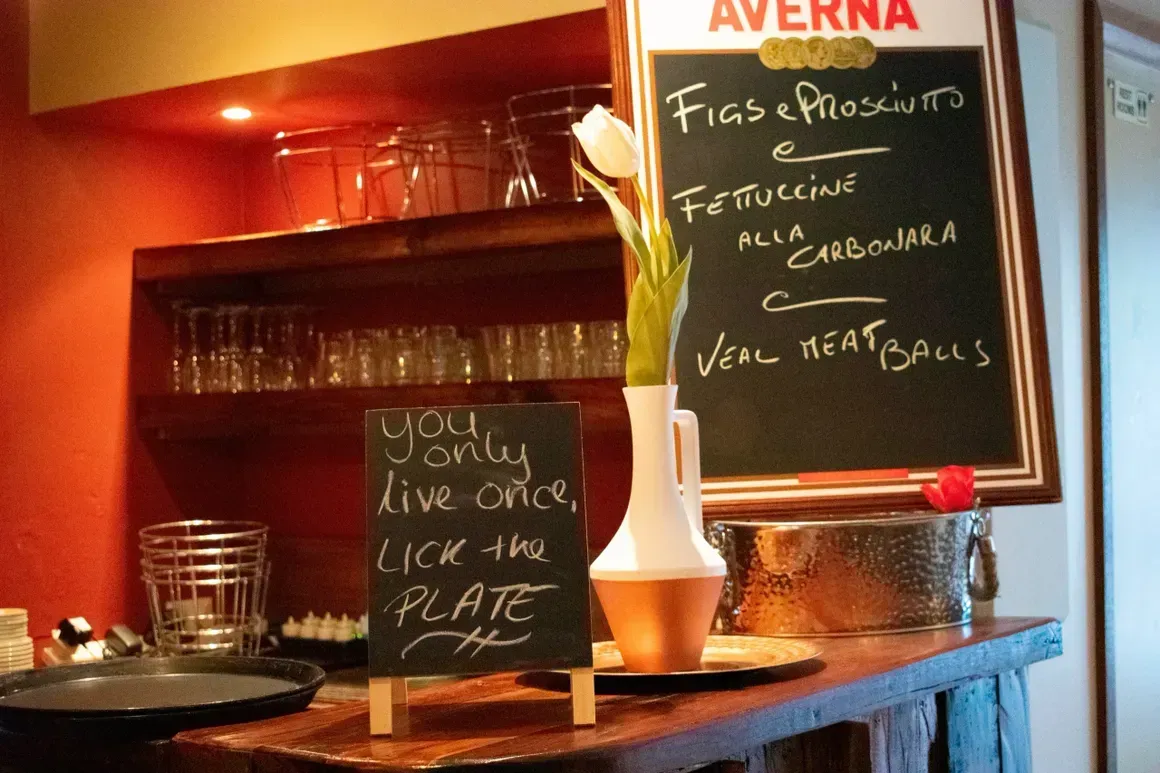 A chalkboard with a sign that says 