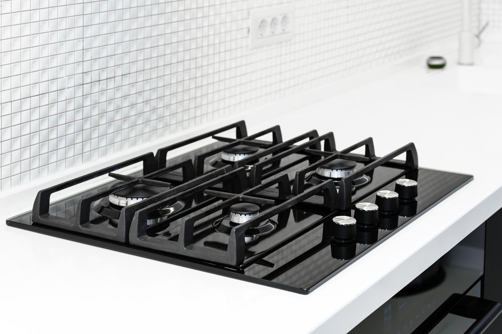 A Black Gas Stove is Sitting on Top of a White Counter — FC Gas Fitting in Maryborough, QLD