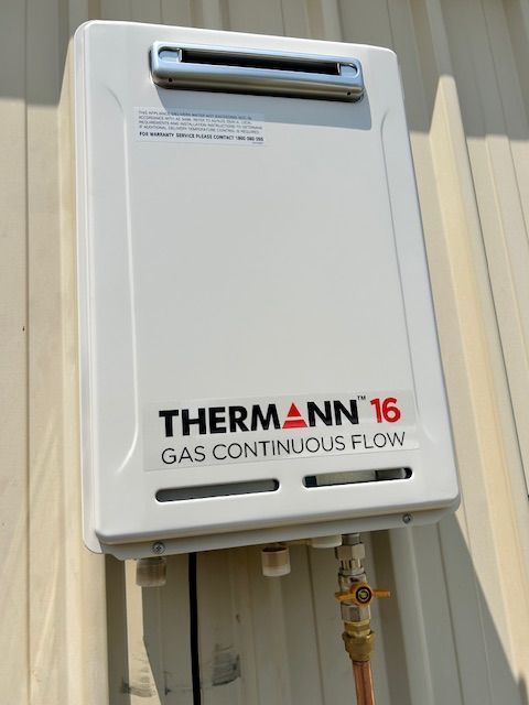 A white gas continuous flow water heater — FC Gas Fitting in Maryborough, QLD