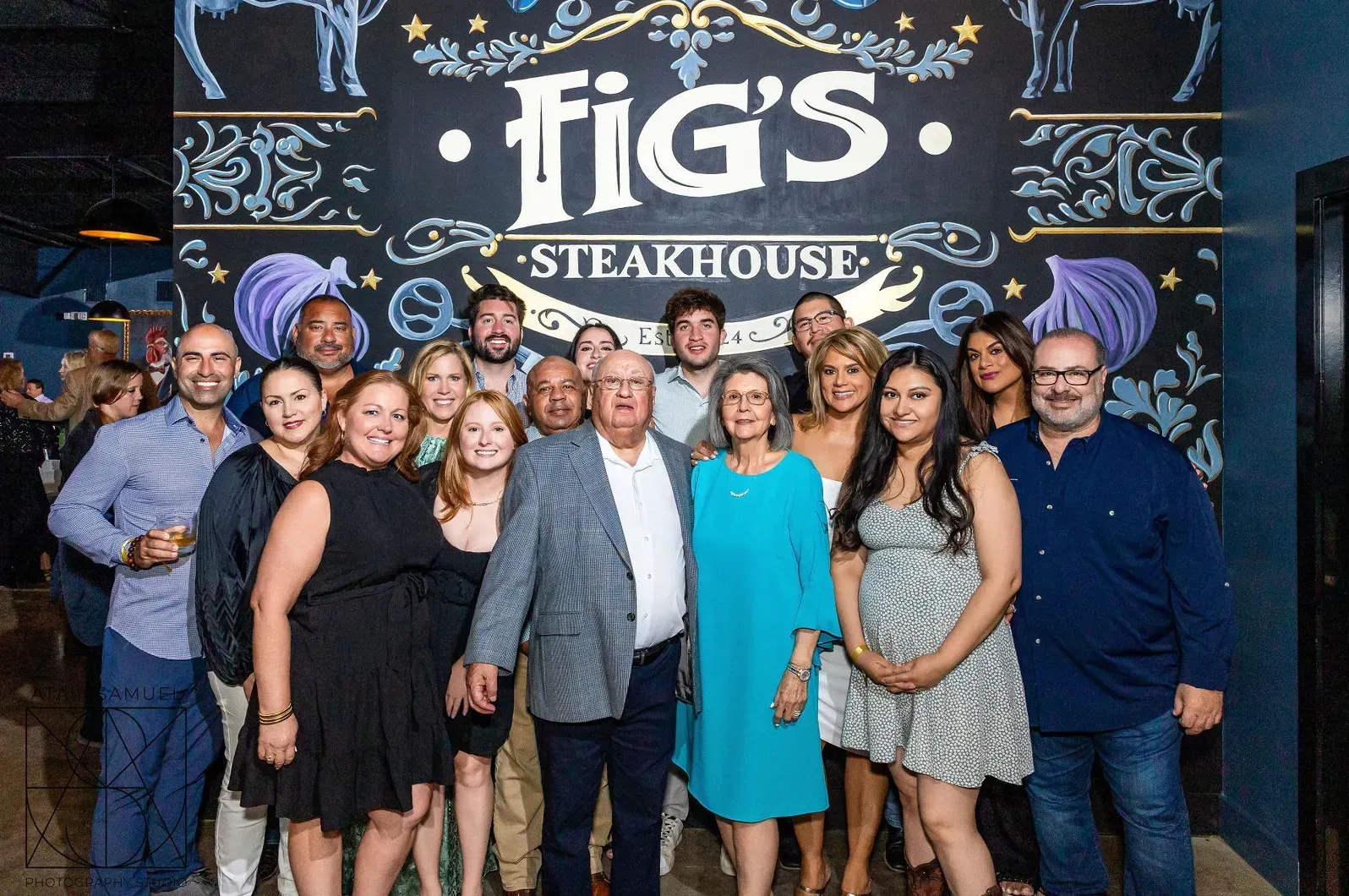 Group of people posing in front of