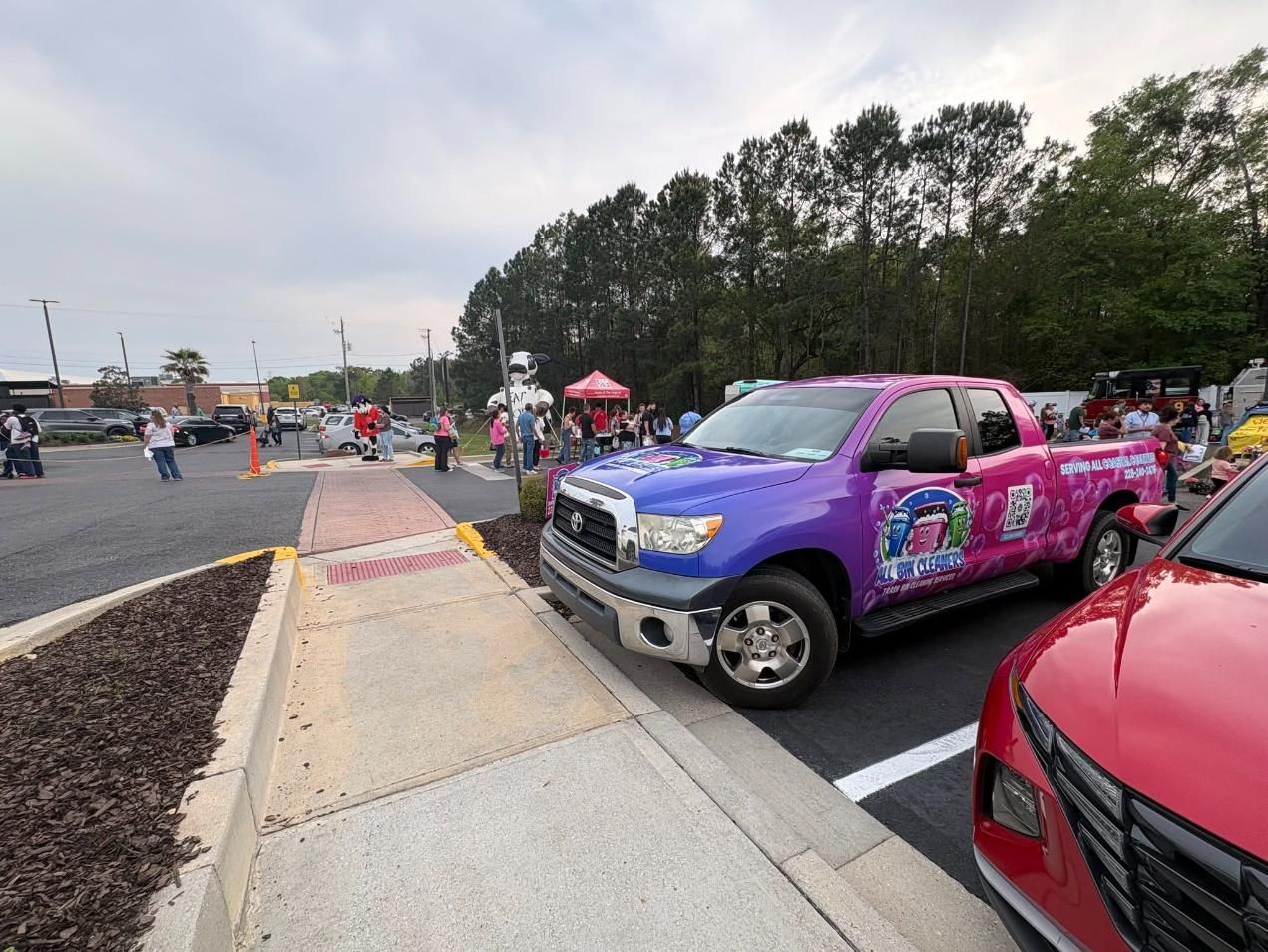 Colorful custom pickup truck at a car