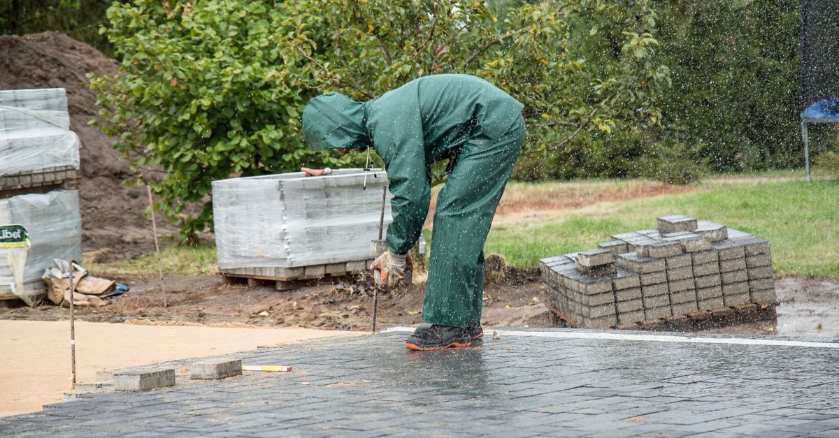 Landscaping company owner discussing a yard project with a homeowner