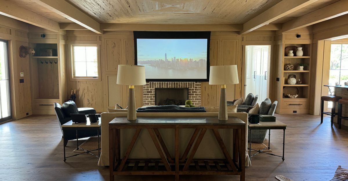 AV installer consulting with a homeowner in a high-end home theater