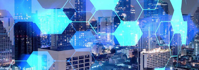 A cityscape with a lot of buildings and a lot of blue lights.