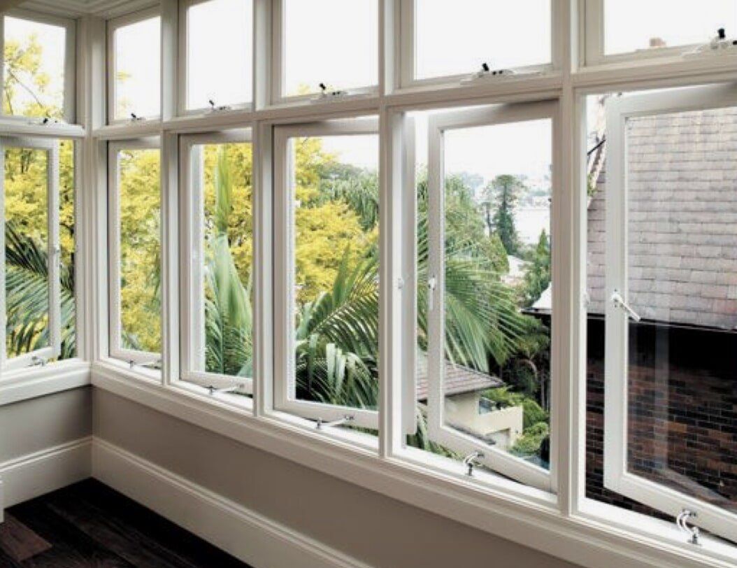 A Room With A Lot Of Windows And Trees In The Background — Nambucca Glass in Nambucca Heads, NSW