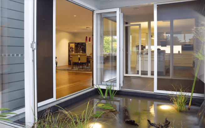 Bi Fold Doors Opened To The Outdoor Area — Nambucca Glass in Nambucca Heads, NSW