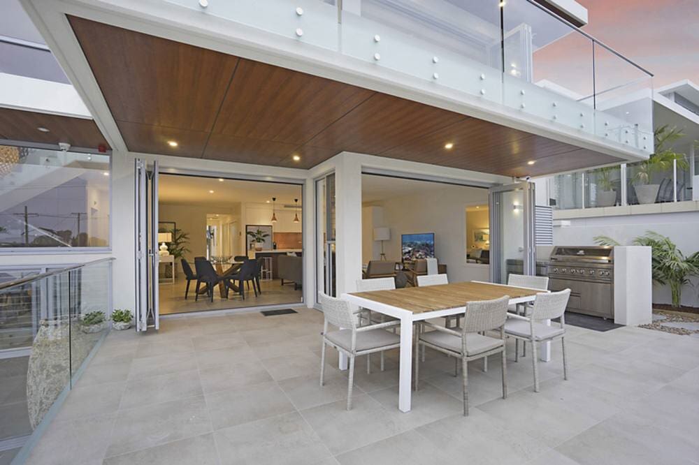 There Is A Table And Chairs On The Patio Of A House — Nambucca Glass in Sawtell, NSW