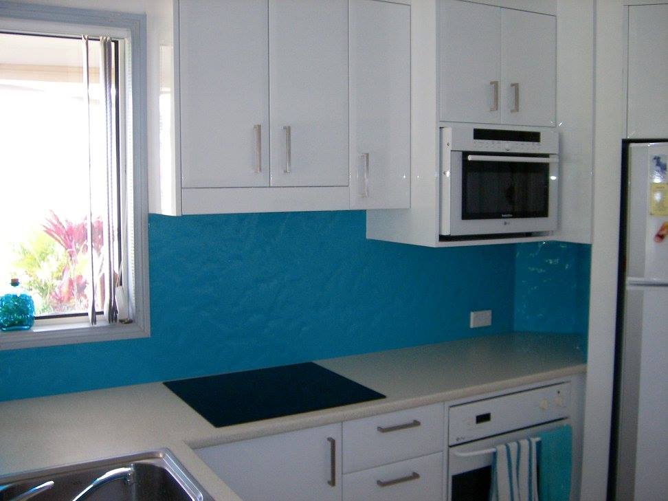 A Kitchen With White Cabinets And A Blue Backsplash — Nambucca Glass in Nambucca Heads, NSW