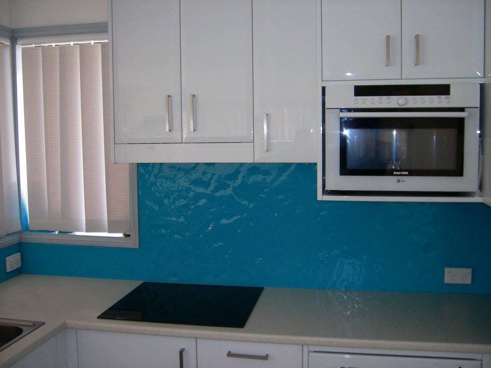 A Kitchen With White Cabinets And A Blue Backsplash — Nambucca Glass in Nambucca Heads, NSW