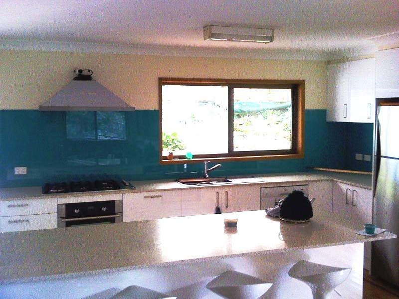 A Kitchen With White Cabinets And A Stove Top Oven — Nambucca Glass in Nambucca Heads, NSW