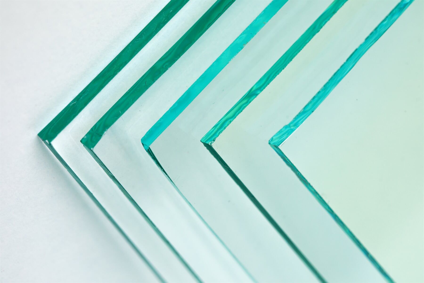 Several Pieces Of Clear Glass Are Stacked On Top Of Each Other — Nambucca Glass in Nambucca Heads, NSW