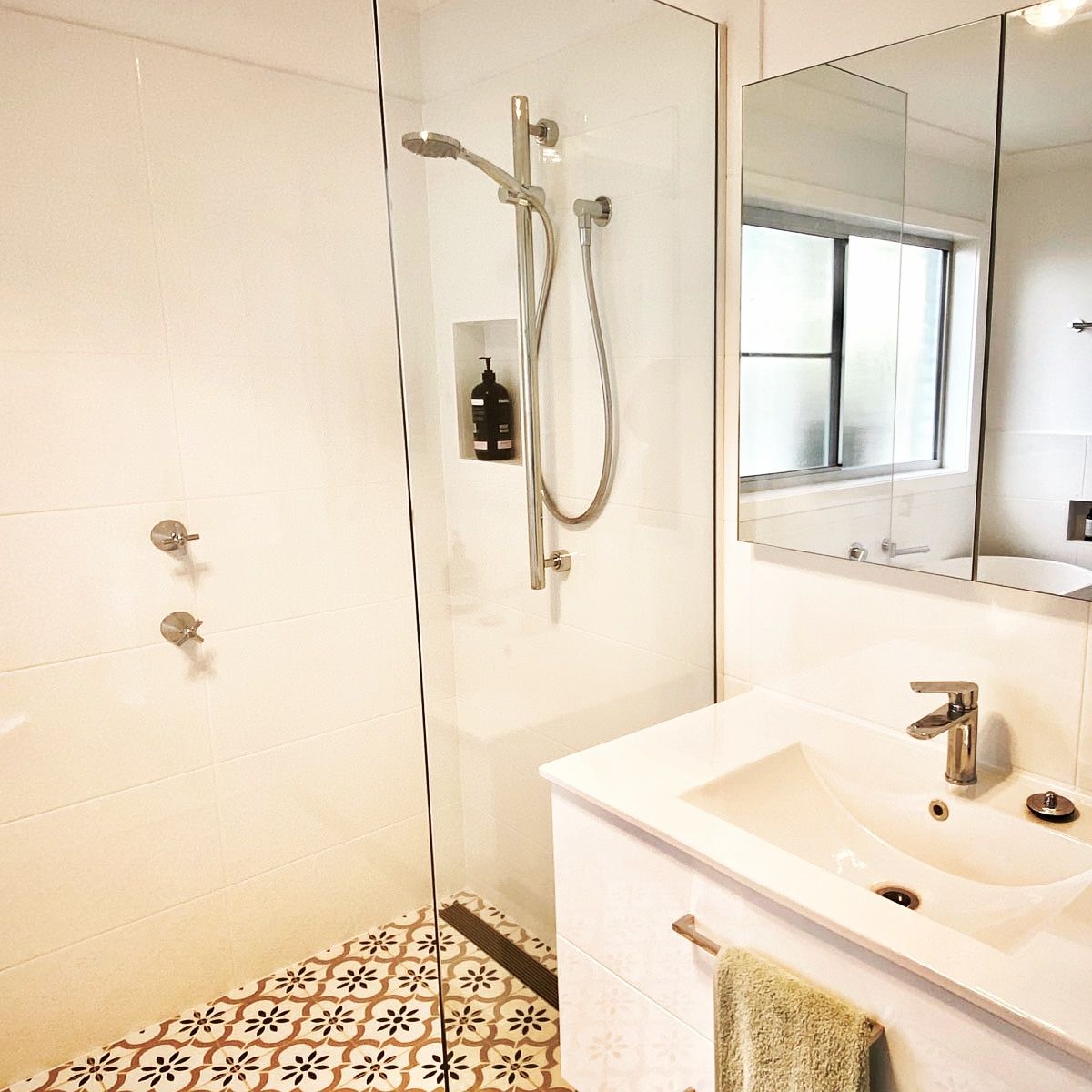 A Bathroom With A Sink A Shower And A Mirror — Nambucca Glass in Nambucca Heads, NSW
