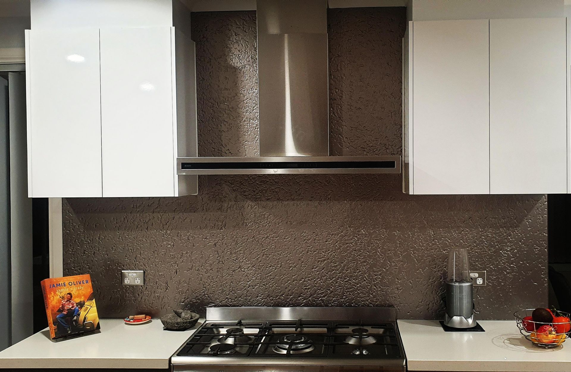 A Kitchen With White Cabinets And A Stove Top Oven — Nambucca Glass in Nambucca Heads, NSW