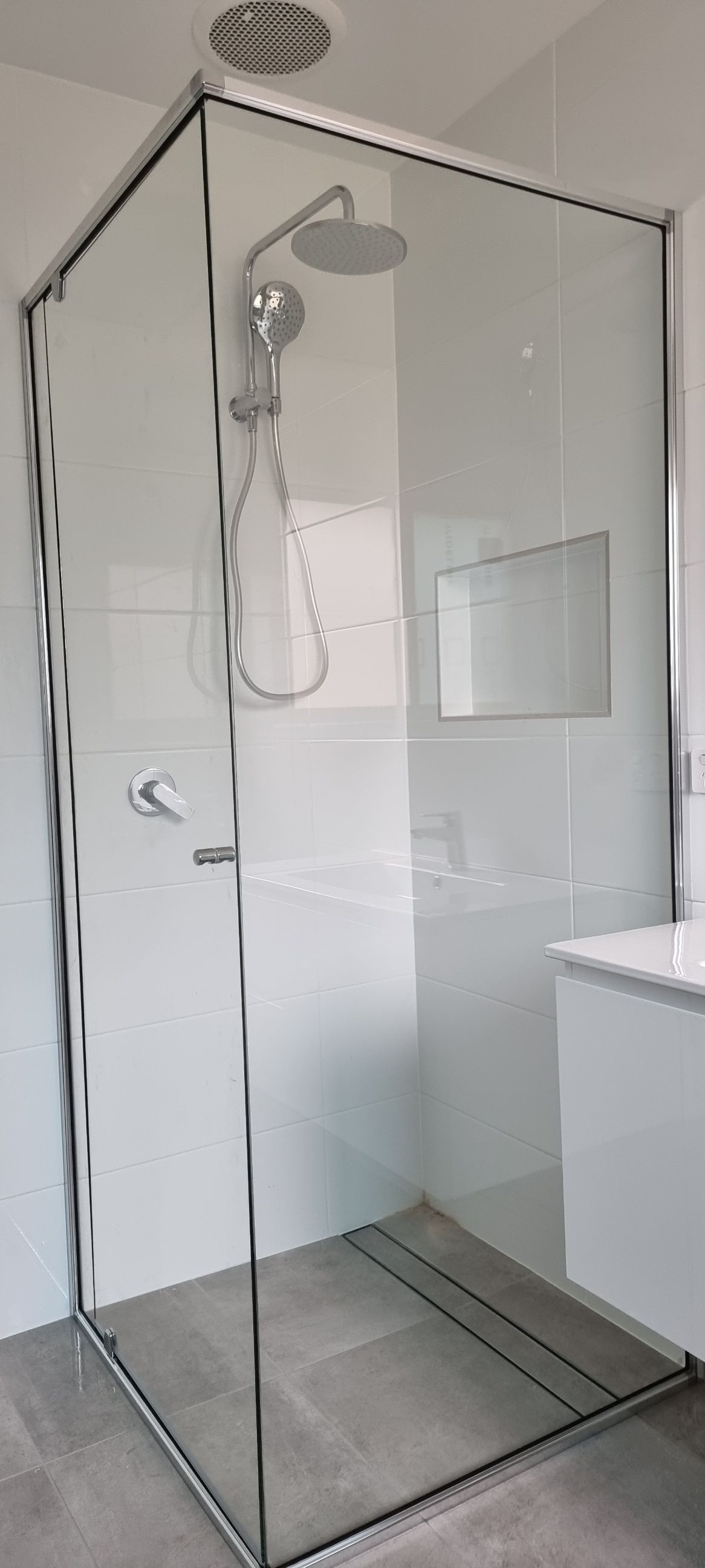 A Bathroom With A Walk In Shower And A Sink — Nambucca Glass in Nambucca Heads, NSW