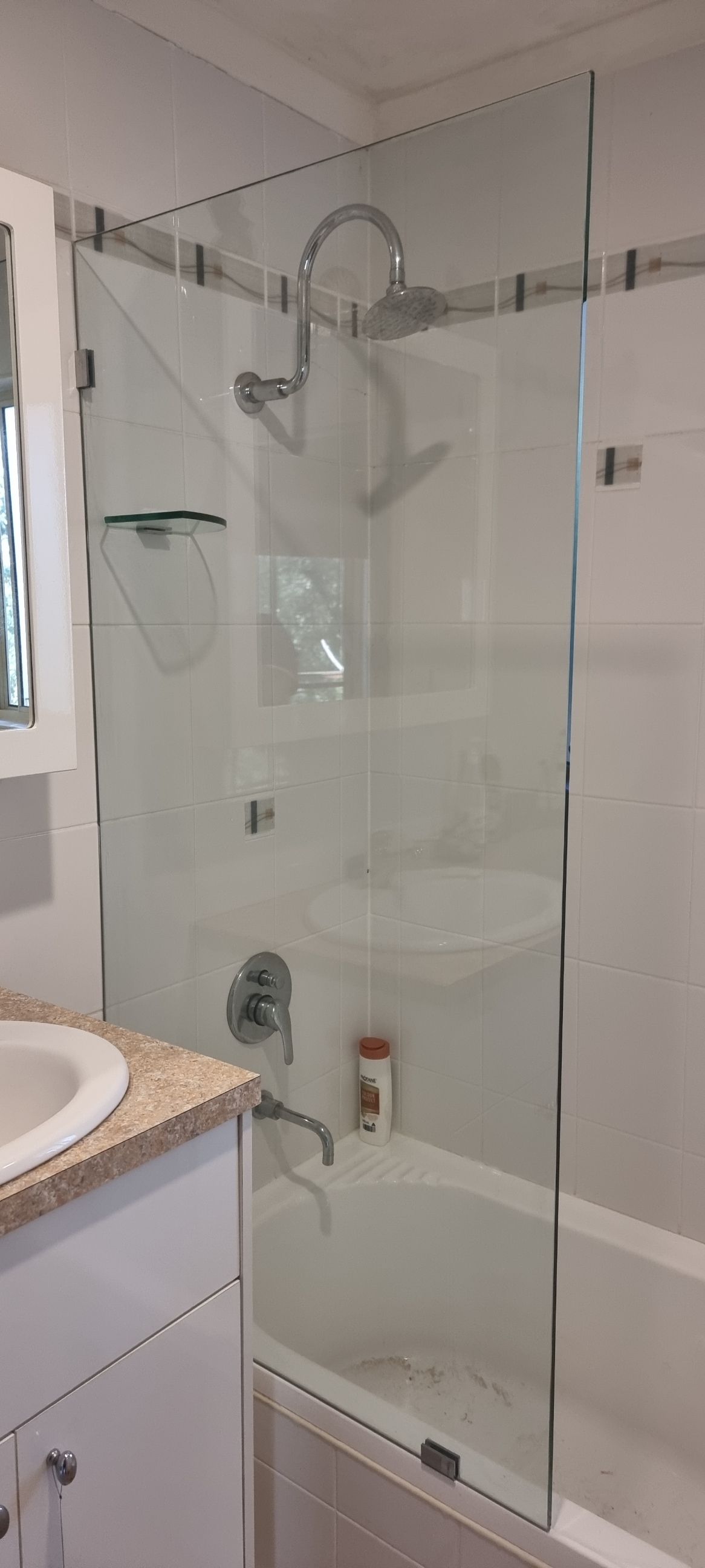 A Bathroom With A Glass Shower Door And A Bathtub — Nambucca Glass in Nambucca Heads, NSW
