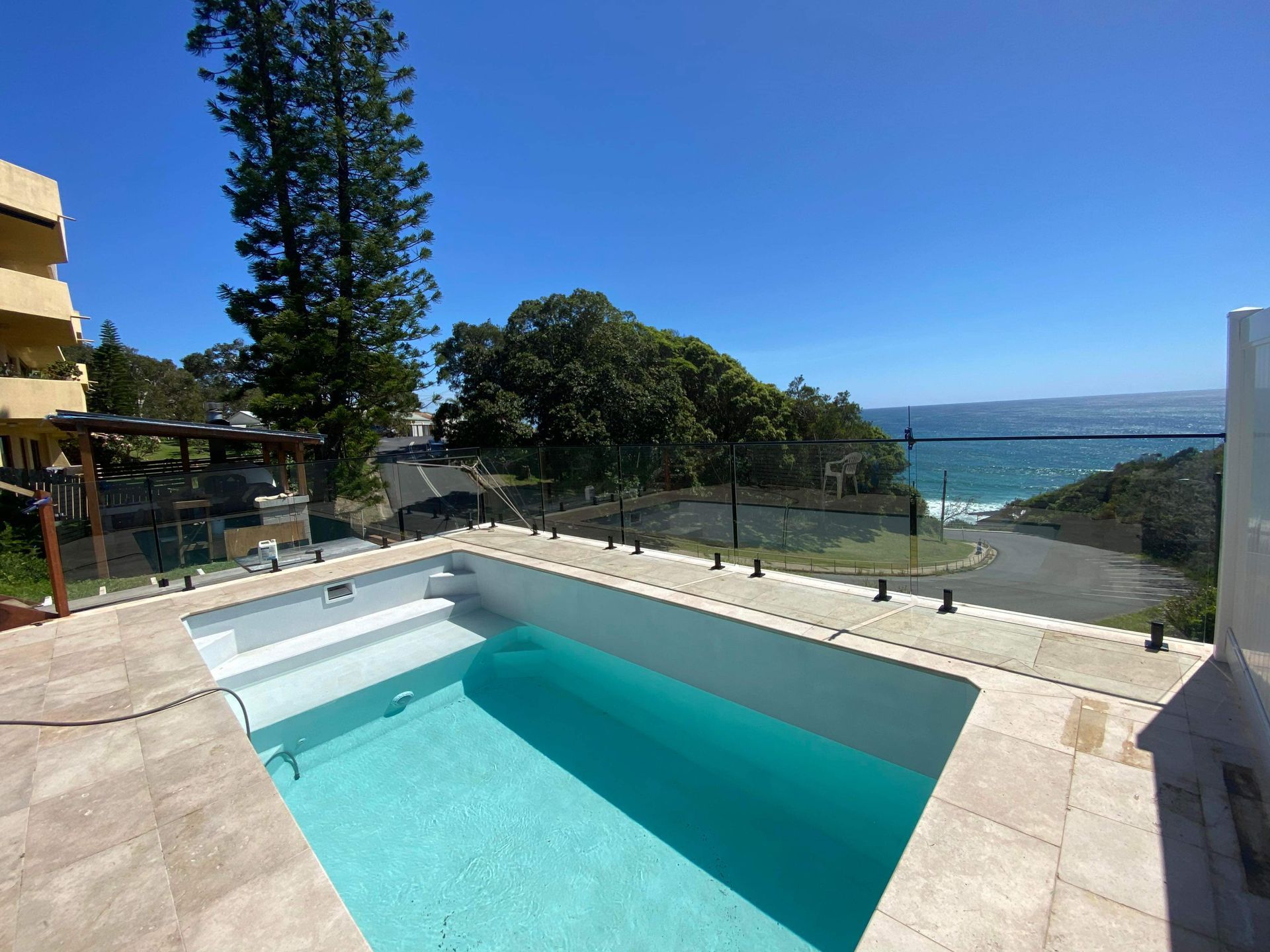 A Large Swimming Pool With A View Of The Ocean — Nambucca Glass in Nambucca Heads, NSW