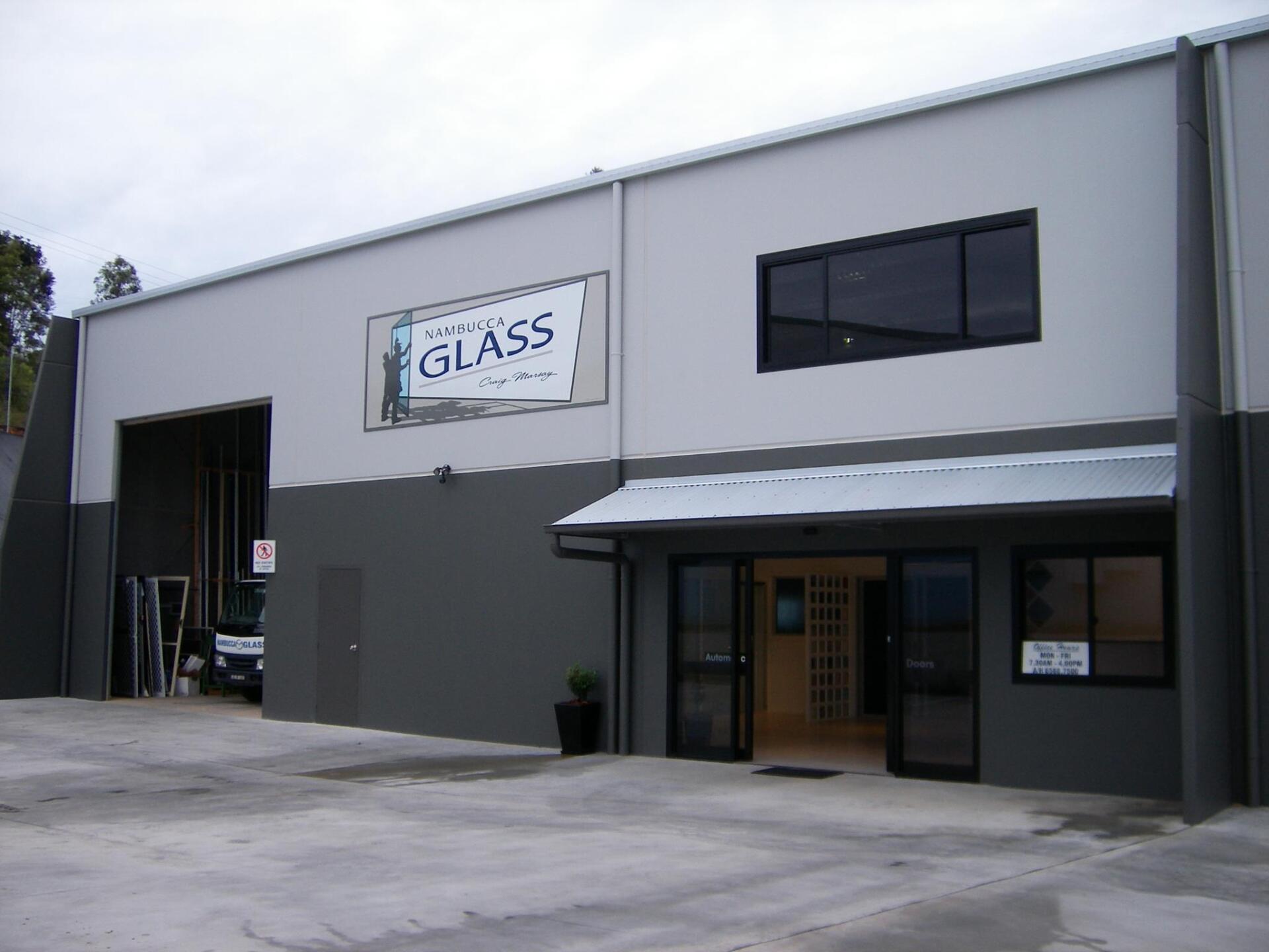 A Building With A Sign That Says Glass On It — Nambucca Glass in Nambucca Heads, NSW