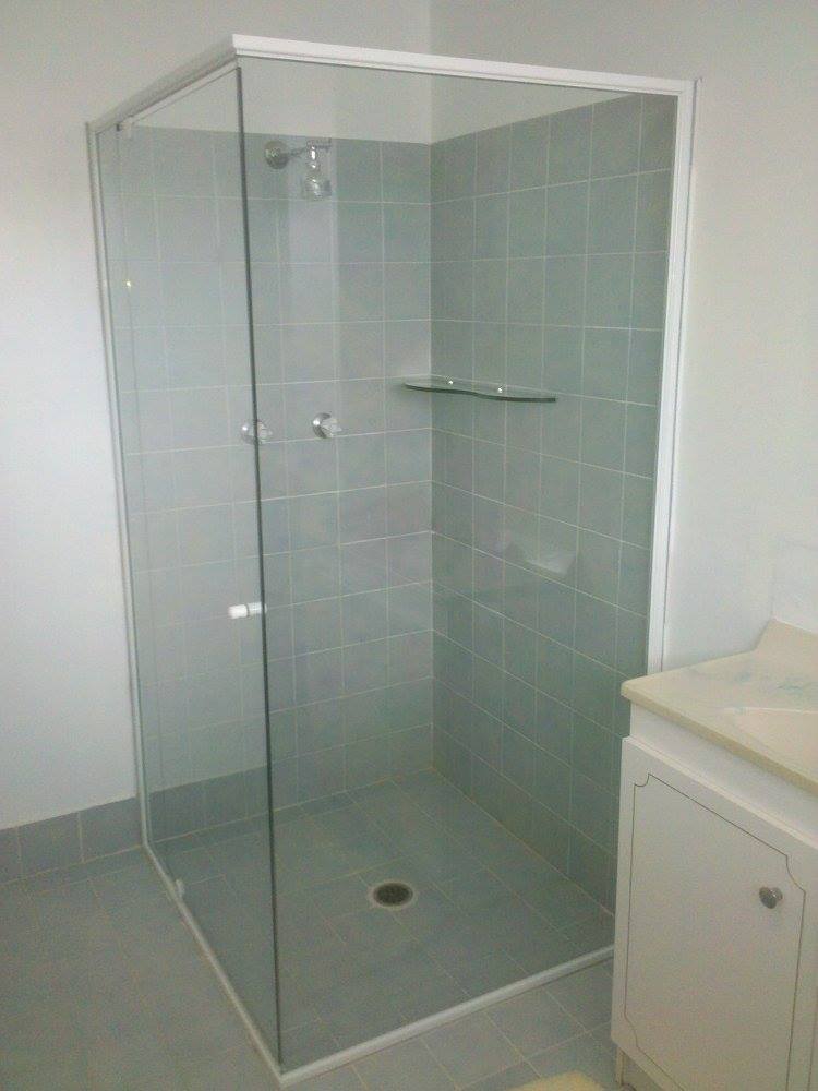 A Bathroom With A Shower Stall And A Sink — Nambucca Glass in Nambucca Heads, NSW