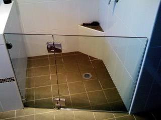 A Bathroom With A Walk In Shower With A Glass Door — Nambucca Glass in Nambucca Heads, NSW