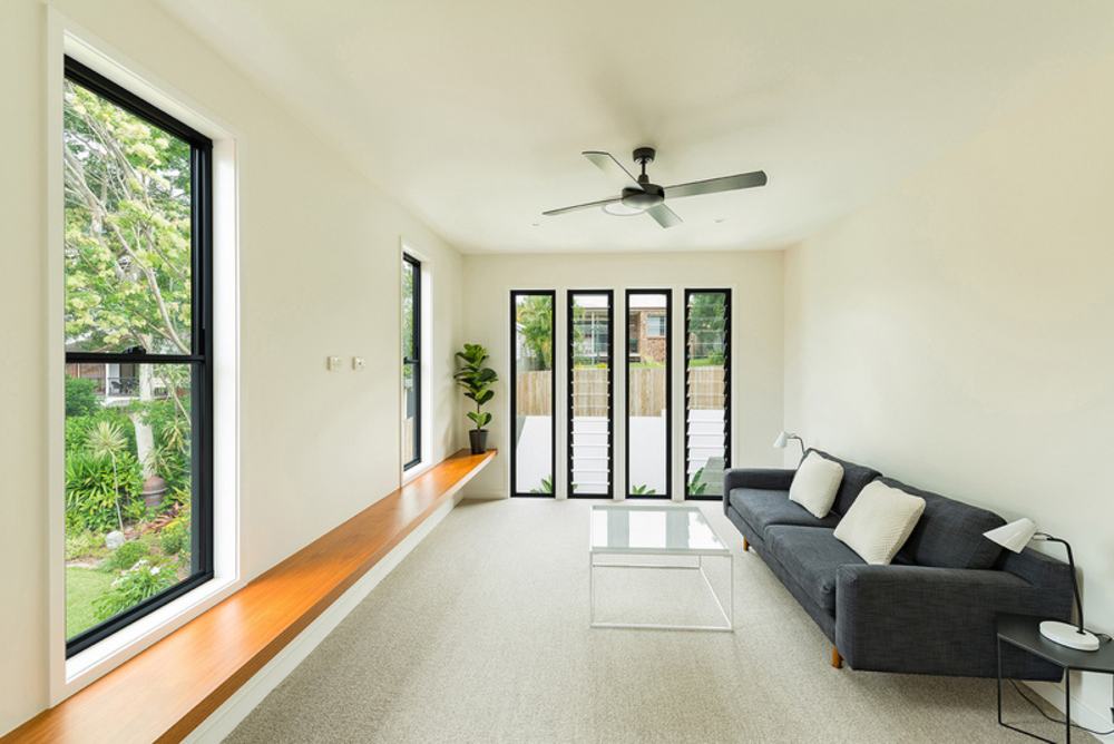 A Living Room With A Couch And A Ceiling Fan — Nambucca Glass in Nambucca Heads, NSW