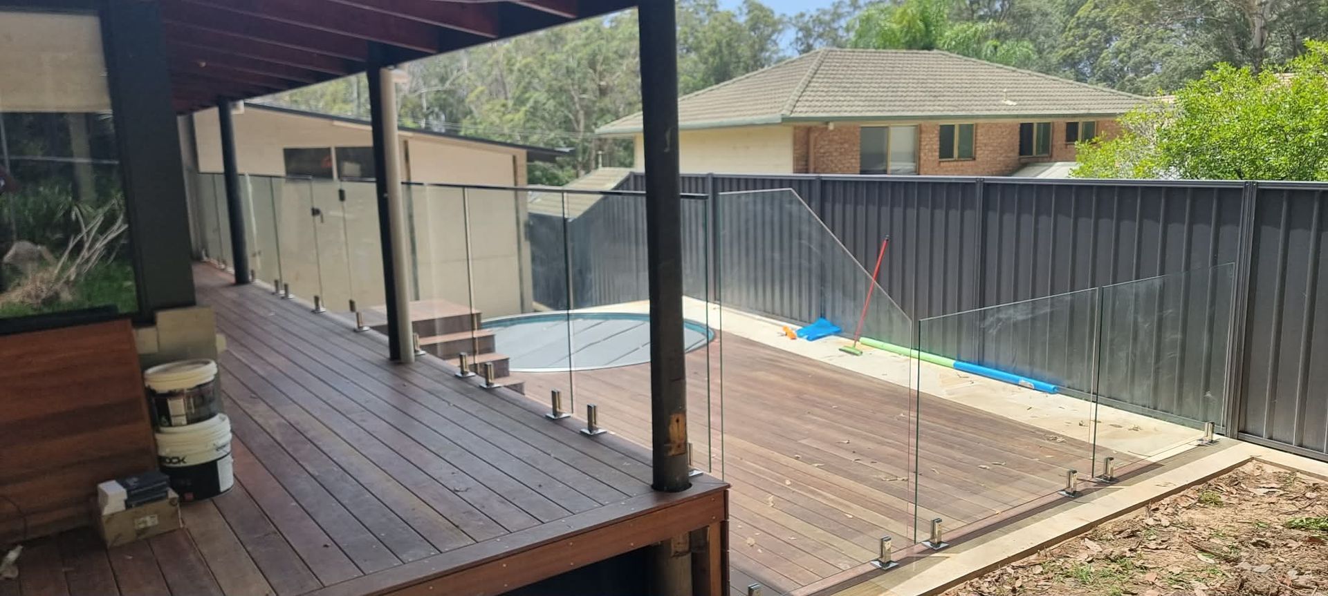 Covered Wooden Deck Beside a Fenced Backyard — Nambucca Glass in Nambucca Heads, NSW