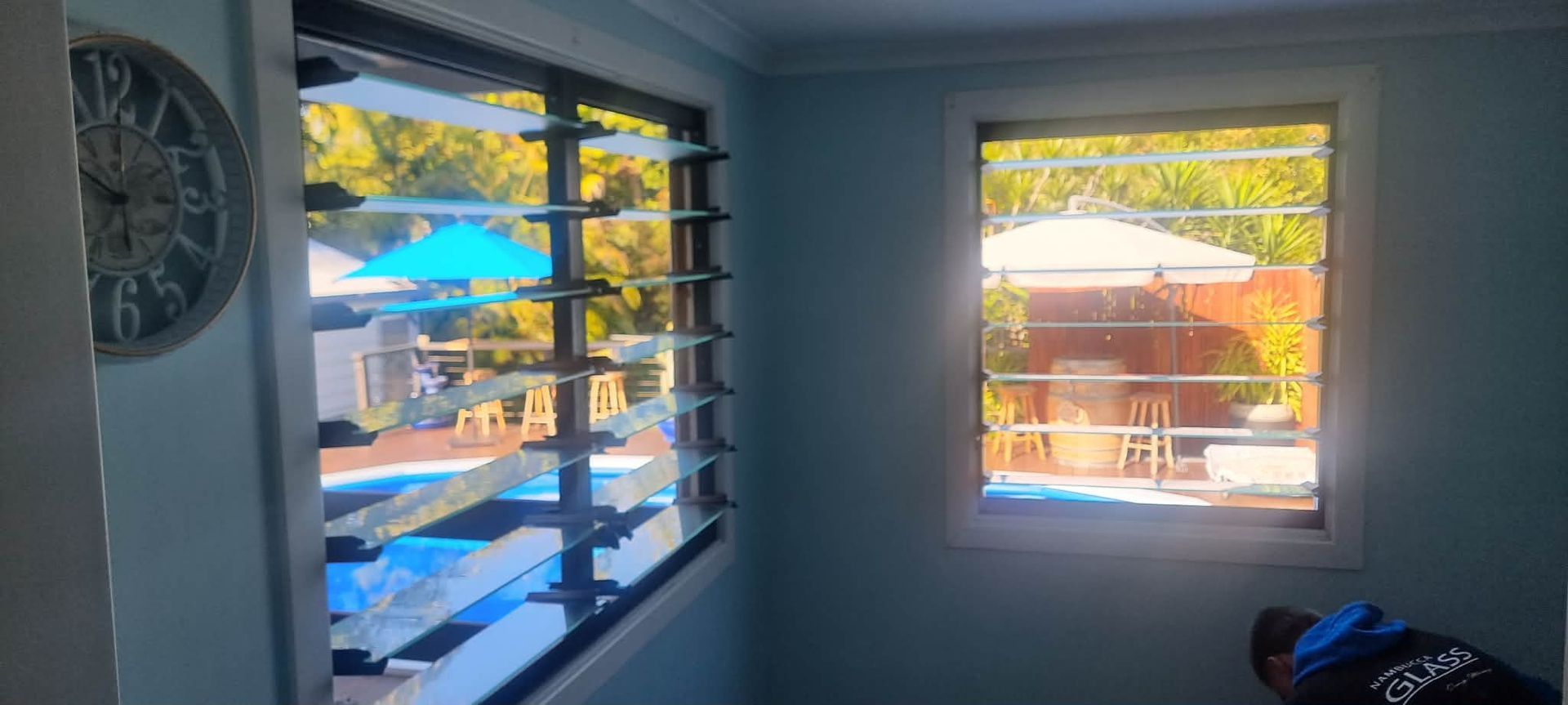 Living Room With Two Windows Looking Out to a Sunny Patio — Nambucca Glass in Nambucca Heads, NSW