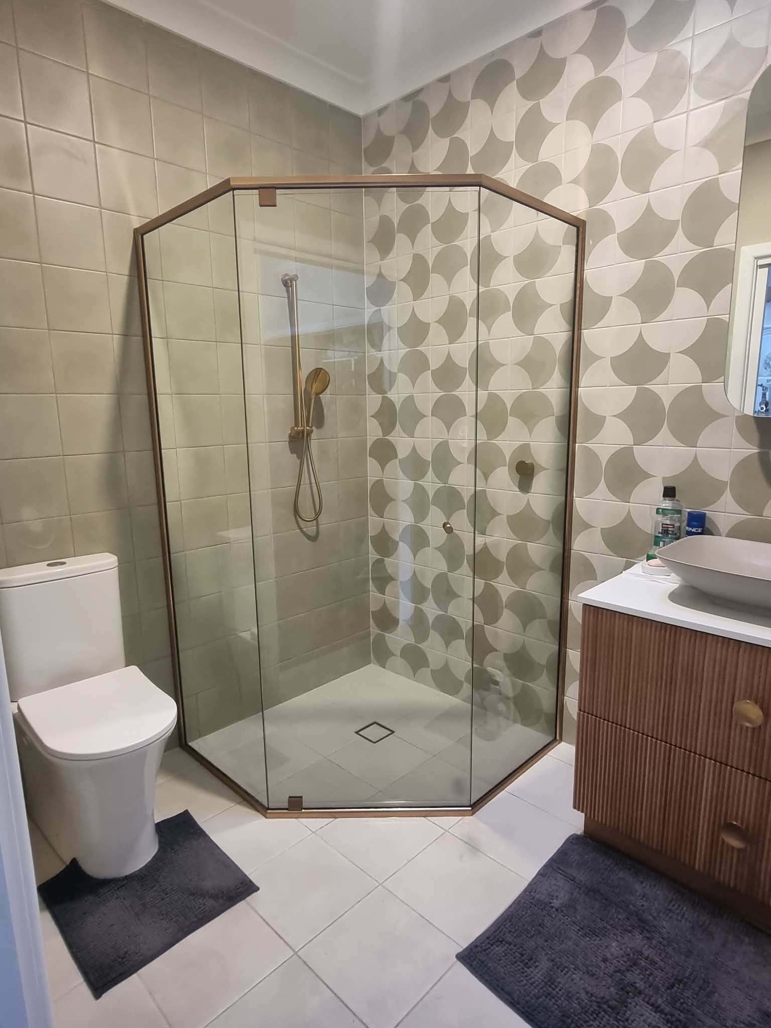 Glass Corner Shower in a Beige-tiled Bathroom — Nambucca Glass in Nambucca Heads, NSW
