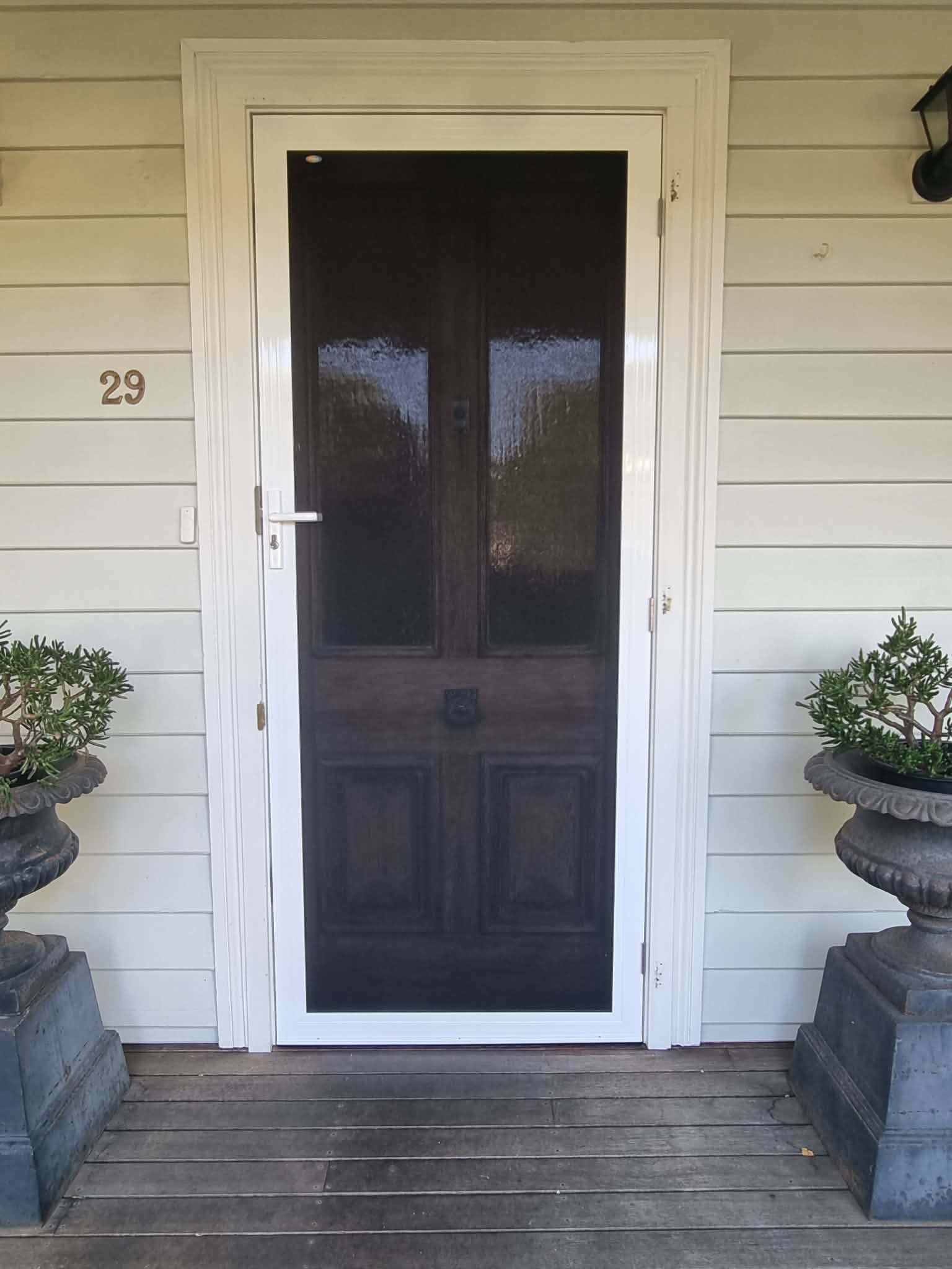 White Front Door with Screen Door on A House Porch — Nambucca Glass in Nambucca Heads, NSW