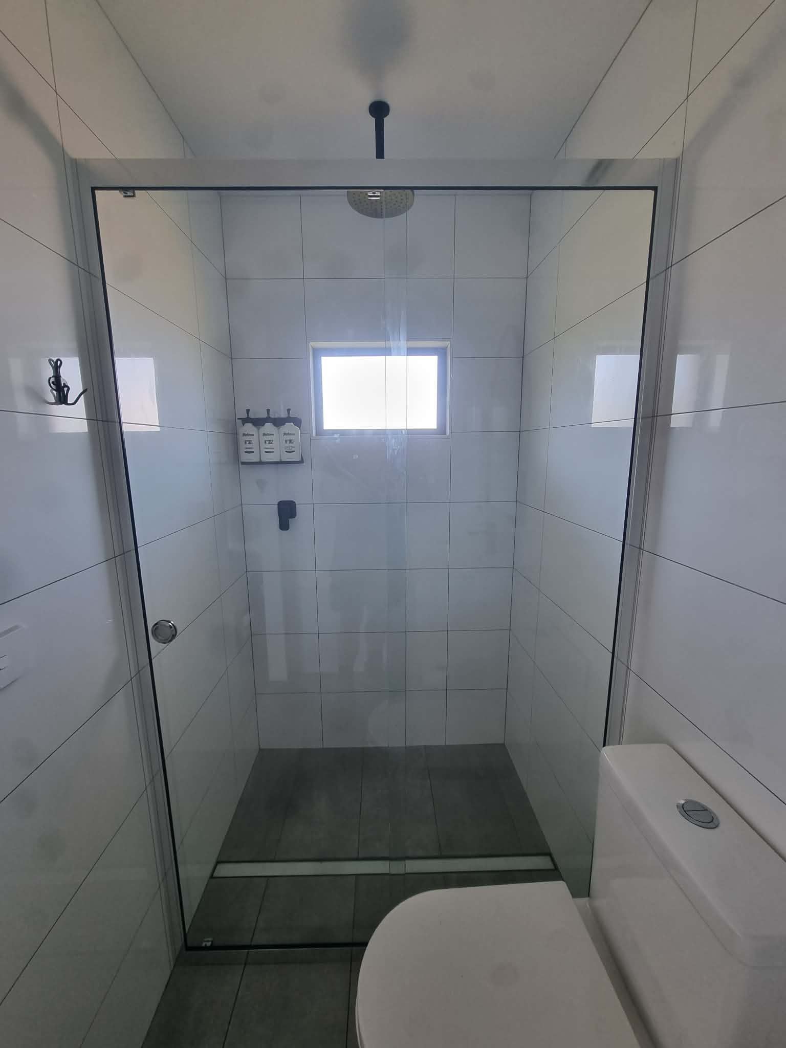 Accessible Shower Stall With White Tile Walls — Nambucca Glass in Nambucca Heads, NSW