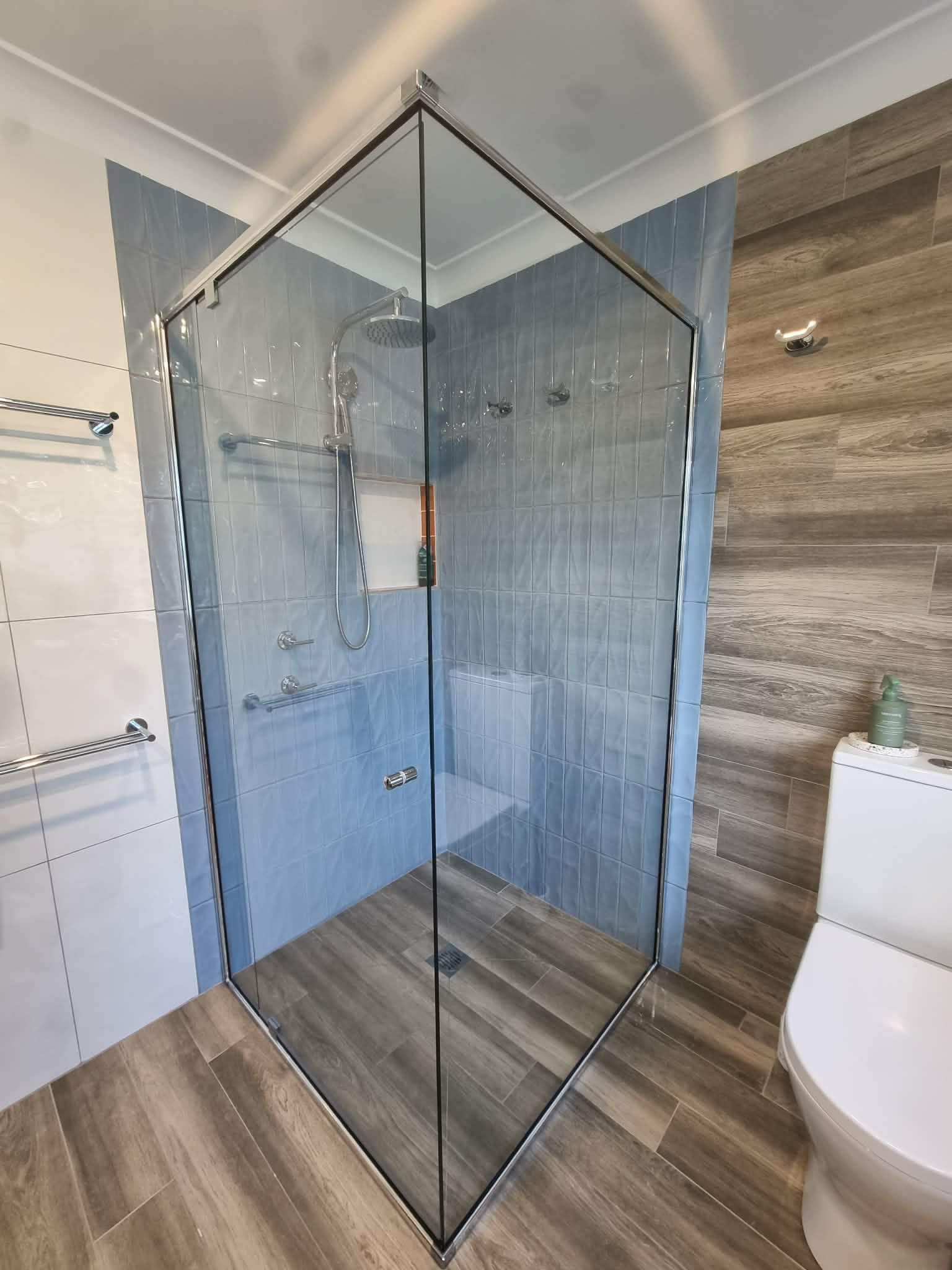 Glass Shower Enclosure in a Modern Bathroom With Wood-look Tile — Nambucca Glass in Nambucca Heads, NSW