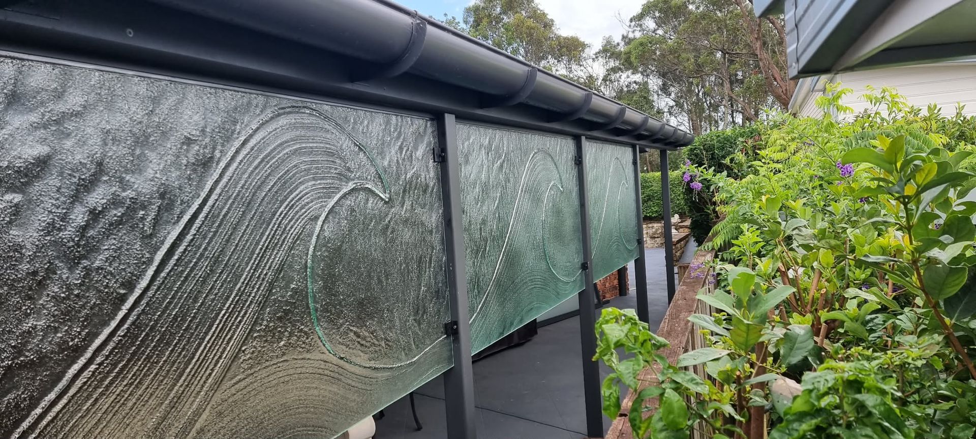Rain-streaked Greenhouse Windows Beside a Narrow Garden Path — Nambucca Glass in Nambucca Heads, NSW