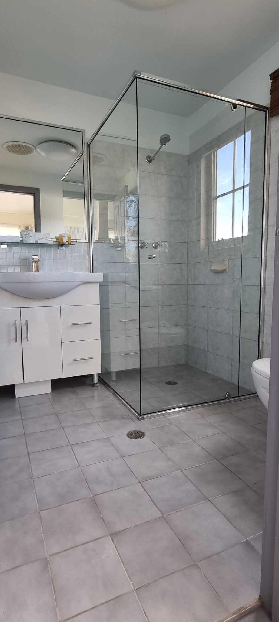 Bright Bathroom with Glass-Enclosed Shower — Nambucca Glass in Nambucca Heads, NSW