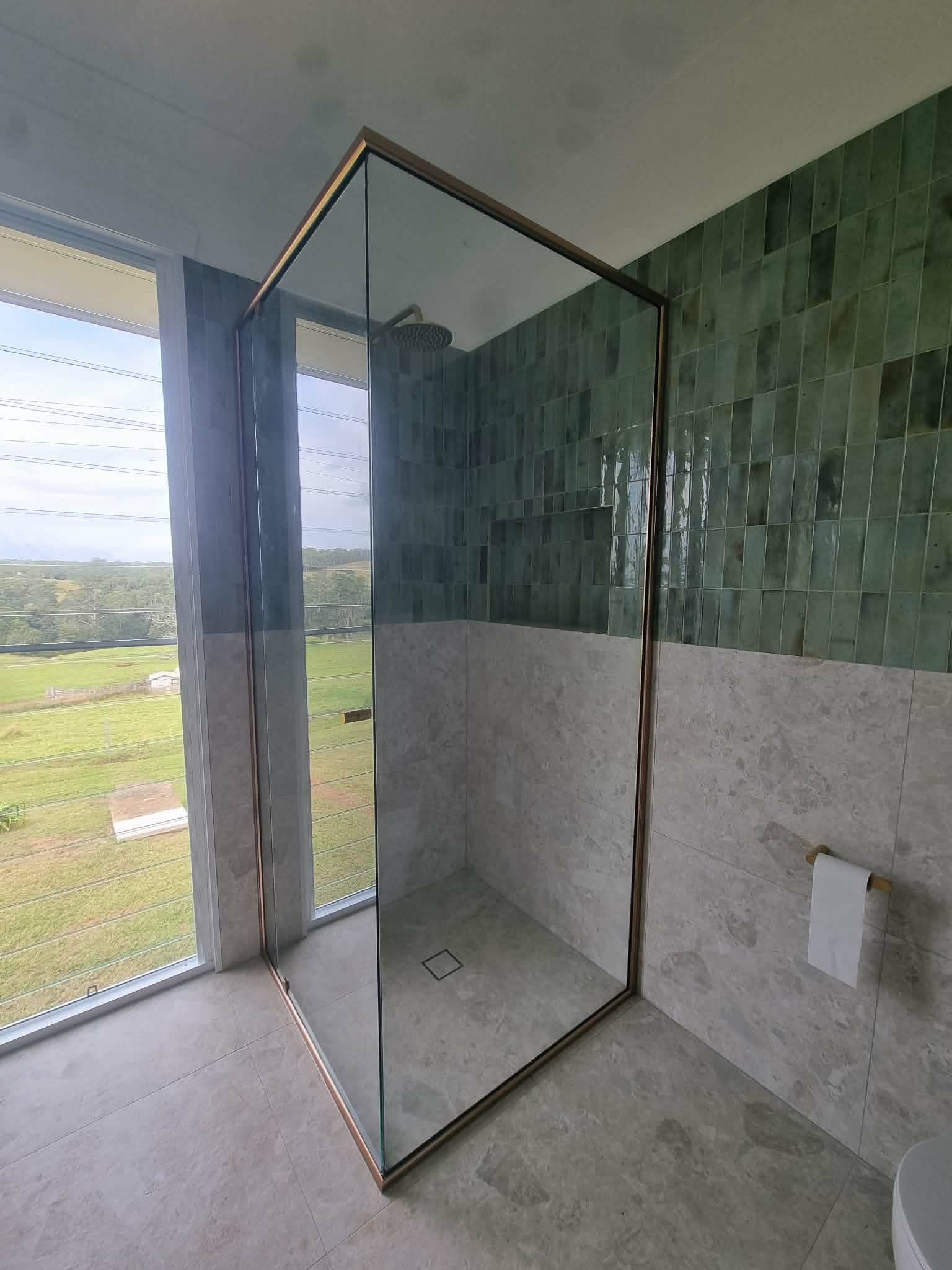 Empty Shower Stall with Green and Gray Tiled Walls — Nambucca Glass in Nambucca Heads, NSW