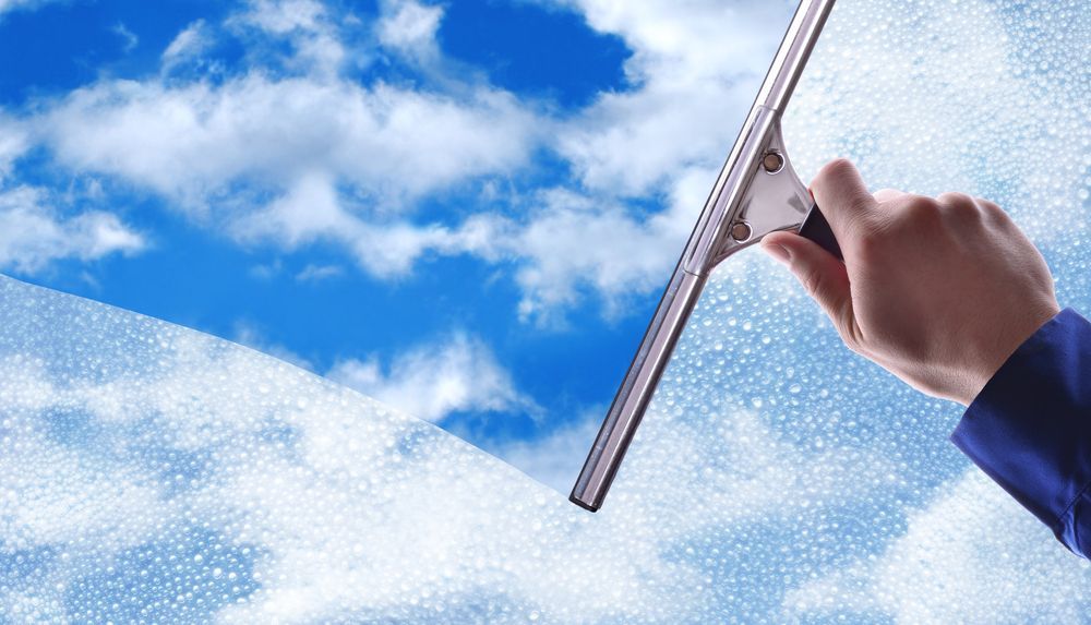 Window cleaning with squeegee