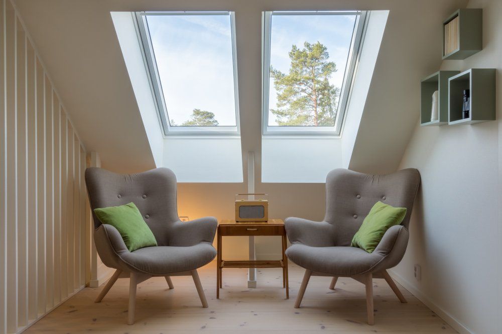 A Room With Two Chairs And A Table Under A Skylight — Nambucca Glass in Sawtell, NSW
