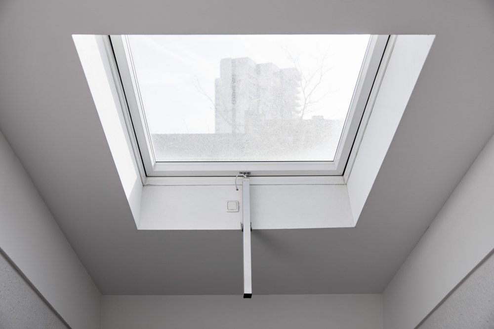 A Electric Skylight In The Ceiling Of A Room — Nambucca Glass in Nambucca Heads, NSW