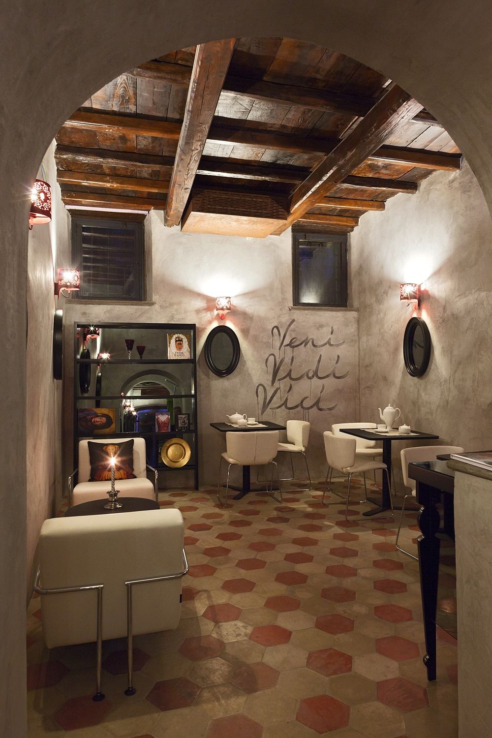 A room with tables and chairs and a sign on the wall that says mani mani rice