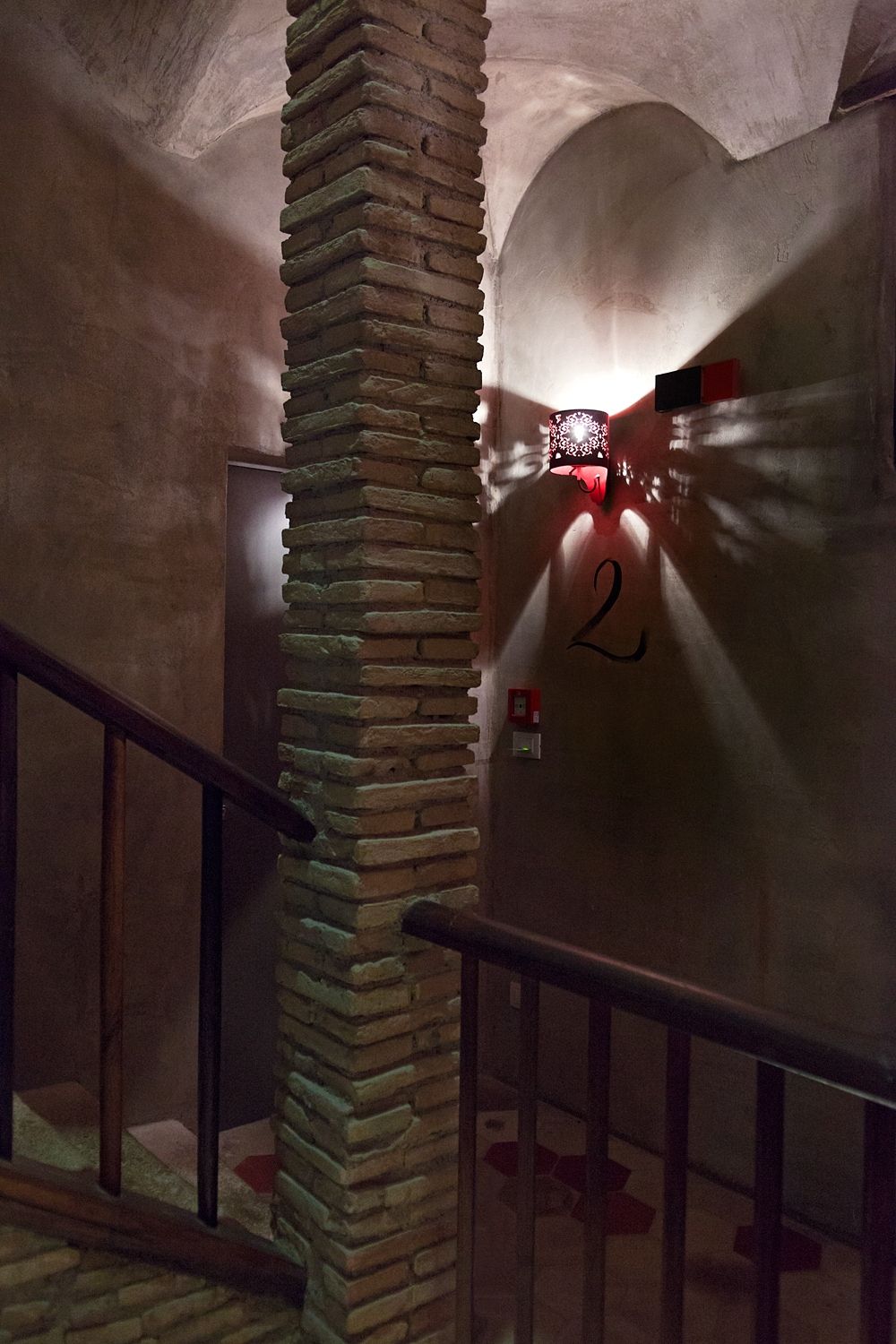 A staircase with the number 2 on the wall