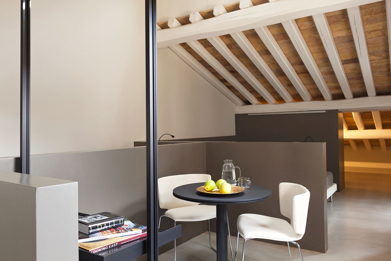 A room with a table and chairs in it