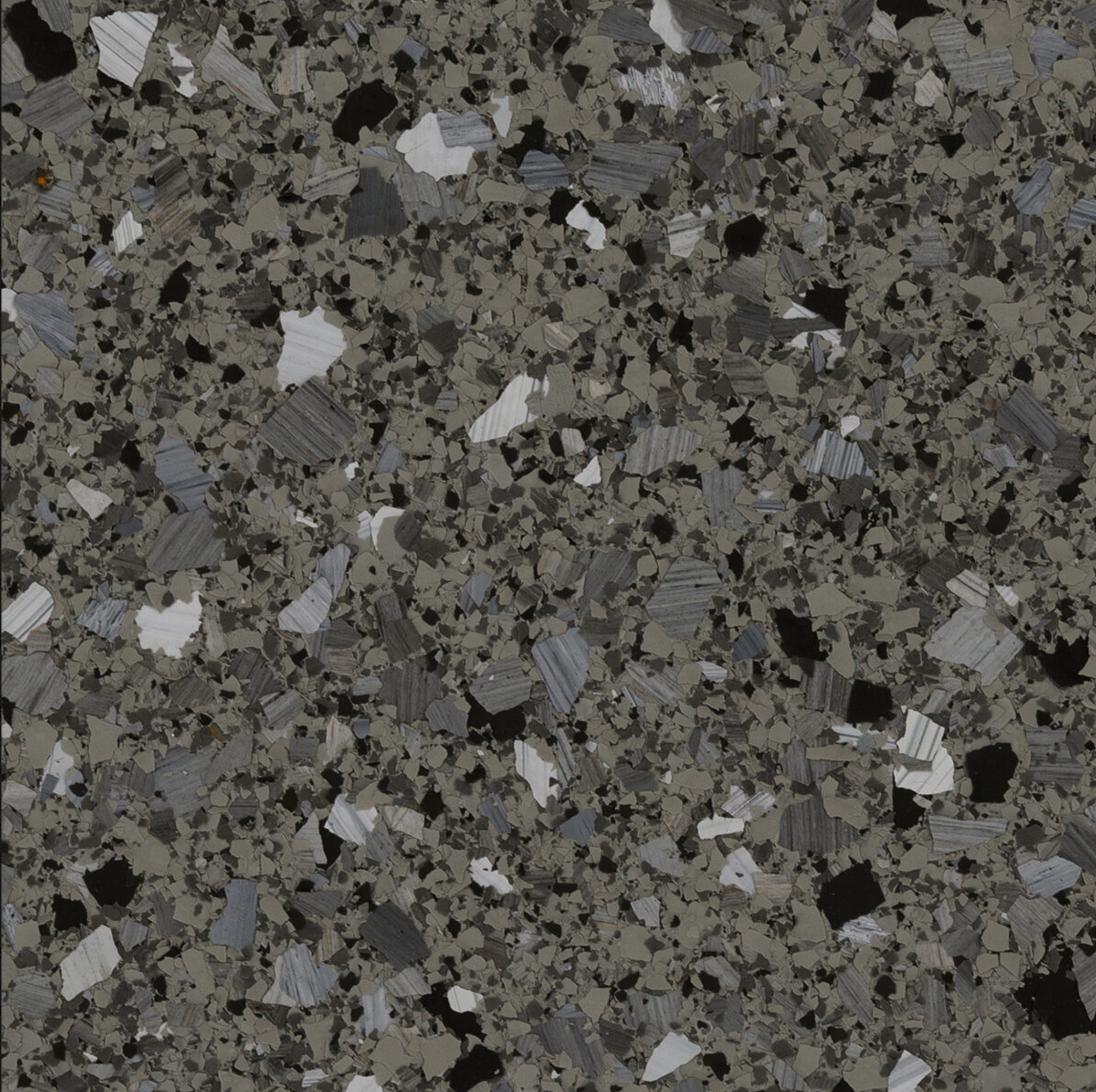 Un gros plan d'une texture de granit gris et noir.