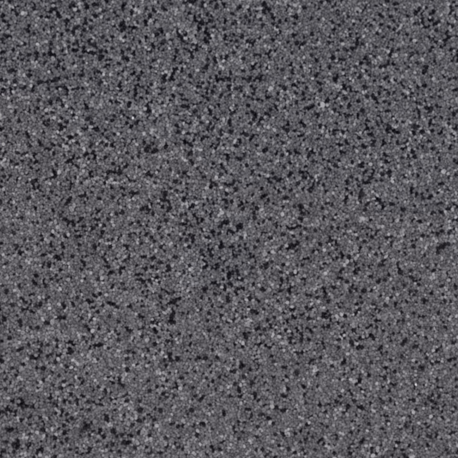 Gray speckled surface, possibly granite or countertop material.